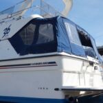 Fairline Sedan 36 - Stern view showing bathing platform, ladder and fender baskets.