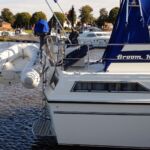 Broom 1070 - Stern view with bathing platform, boarding ladder and davits . Zodiac dinghy with 6hp Yamaha outboard engine.