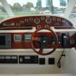 Jeanneau Prestige 36 - Internal helmstation with navigation equipment and instrument gauges to hand.