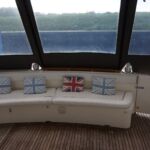 Jeanneau Prestige 36 - Spacious aft cockpit with seating, transom gate and teak laid deck